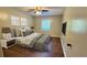 Comfortable bedroom with hardwood floors, a soft bed, and ample natural light at 4550 Cypress Ridge Ct, Stone Mountain, GA 30083