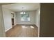 Bright dining room with natural light, wood floors, and a view to the kitchen at 4550 Cypress Ridge Ct, Stone Mountain, GA 30083