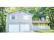 Charming home with two-car garage and inviting front porch at 4550 Cypress Ridge Ct, Stone Mountain, GA 30083