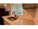 Close-up of granite counters, stainless steel sink, black faucet, and subway tile backsplash at 4550 Cypress Ridge Ct, Stone Mountain, GA 30083
