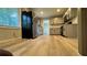 Updated kitchen with stainless steel appliances, light gray cabinets, and wood-look flooring at 4550 Cypress Ridge Ct, Stone Mountain, GA 30083