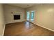 Bright living room with brick fireplace and wood flooring at 4550 Cypress Ridge Ct, Stone Mountain, GA 30083