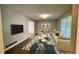 Bright living room with hardwood floors, modern sofa and white coffee tables at 4550 Cypress Ridge Ct, Stone Mountain, GA 30083