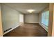 Spacious living room features wood flooring and a view to the entryway at 4550 Cypress Ridge Ct, Stone Mountain, GA 30083