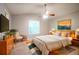 Serene bedroom featuring natural light, a neutral color scheme, and contemporary decor at 7021 New Dale Rd, Rex, GA 30273