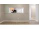 Dining area with a pass-through view of the kitchen, creating an open and airy space at 7021 New Dale Rd, Rex, GA 30273