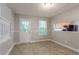 Bright dining area featuring natural light, with access to the kitchen and the backyard at 7021 New Dale Rd, Rex, GA 30273