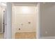 Spacious laundry room with ample space for a washer, dryer, and storage at 7021 New Dale Rd, Rex, GA 30273