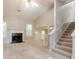Living room featuring a fireplace, carpet, and a staircase to the second floor at 7021 New Dale Rd, Rex, GA 30273