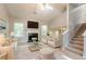 Bright living room with vaulted ceilings, fireplace, and plush neutral furnishings at 7021 New Dale Rd, Rex, GA 30273