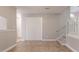 Open floor plan features a staircase, closet, and access to other rooms at 7021 New Dale Rd, Rex, GA 30273