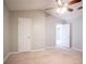 Spacious main bedroom with ceiling fan, plush carpet and neutral walls at 7021 New Dale Rd, Rex, GA 30273