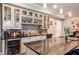 Basement bar with stainless steel appliances, wine storage, and countertop seating at 3015 Guardian Nw Walk, Kennesaw, GA 30152