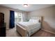Comfortable bedroom with a tufted headboard, soft bedding, and natural light from the window at 3015 Guardian Nw Walk, Kennesaw, GA 30152