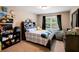 Comfortable bedroom with a large window, black-out curtains, and shelving at 3015 Guardian Nw Walk, Kennesaw, GA 30152