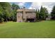 This spacious backyard features a well-maintained lawn and deck, ideal for outdoor entertaining or relaxing at 3015 Guardian Nw Walk, Kennesaw, GA 30152