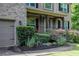 Charming two-story brick home featuring landscaped yard and an attached two-car garage at 3015 Guardian Nw Walk, Kennesaw, GA 30152