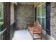 Covered porch with a charming bench seating area at 3015 Guardian Nw Walk, Kennesaw, GA 30152