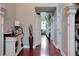 Inviting front hall featuring hardwood floors, elegant columns, and an adjacent staircase at 3015 Guardian Nw Walk, Kennesaw, GA 30152