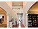 Inviting front hall featuring hardwood floors, elegant columns, and an adjacent staircase at 3015 Guardian Nw Walk, Kennesaw, GA 30152