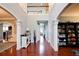 Inviting front hall featuring hardwood floors, elegant columns, and an adjacent staircase at 3015 Guardian Nw Walk, Kennesaw, GA 30152