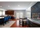 Open-concept kitchen with a large island, stainless steel appliances, and a cozy seating area at 3015 Guardian Nw Walk, Kennesaw, GA 30152