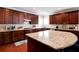 Spacious kitchen island with granite countertop and ample cabinet space, perfect for entertaining guests at 3015 Guardian Nw Walk, Kennesaw, GA 30152