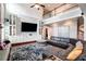 Spacious living room with high ceilings, hardwood floors, and custom built-in shelving surrounding the tv at 3015 Guardian Nw Walk, Kennesaw, GA 30152