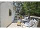 Relaxing back porch with overhead string lights, stylish seating and access to lush, private backyard at 502 Hascall Nw Rd, Atlanta, GA 30309