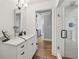 Modern bathroom featuring a glass shower, white vanity, and white subway tile at 502 Hascall Nw Rd, Atlanta, GA 30309
