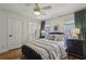 Comfortable bedroom featuring hardwood floors, a ceiling fan and natural lighting at 502 Hascall Nw Rd, Atlanta, GA 30309