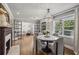 Well-lit dining room featuring a decorative fireplace, crystal chandelier and views of a sitting room at 502 Hascall Nw Rd, Atlanta, GA 30309