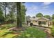 Charming home with well-maintained lawn, mature trees, and back patio perfect for enjoying the outdoors at 502 Hascall Nw Rd, Atlanta, GA 30309