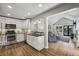 Open concept kitchen with stainless steel appliances, granite countertops, and hardwood floors at 502 Hascall Nw Rd, Atlanta, GA 30309