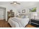 Vaulted ceiling main bedroom featuring hardwood floors and bright neutral decor at 502 Hascall Nw Rd, Atlanta, GA 30309