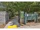 Tanyard Creek Greenspace entrance with signage and accessible pathway in a park-like setting at 502 Hascall Nw Rd, Atlanta, GA 30309