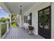 Inviting front porch featuring a bench, railing and a decorative wreath on the front door at 502 Hascall Nw Rd, Atlanta, GA 30309