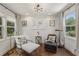 Cozy sitting room with natural light, decorative pillows, and vintage style lighting fixtures at 502 Hascall Nw Rd, Atlanta, GA 30309