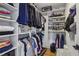 Organized walk-in closet featuring built-in shelving, racks, and ample storage space at 502 Hascall Nw Rd, Atlanta, GA 30309