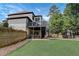 Spacious backyard with multi-level deck, covered patio, and a play area at 2295 Abbey Cove Ct, Marietta, GA 30062