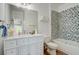 Bathroom with white vanity, patterned tile and a shower-tub combo at 2295 Abbey Cove Ct, Marietta, GA 30062