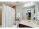 Bathroom featuring vanity with a framed mirror and shower with curtain at 2295 Abbey Cove Ct, Marietta, GA 30062