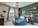 Cozy bedroom featuring a unique accent wall, playful decor, and lots of natural light at 2295 Abbey Cove Ct, Marietta, GA 30062
