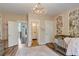 Bedroom featuring pink walls, wood floors, and access to a bathroom at 2295 Abbey Cove Ct, Marietta, GA 30062