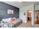 Bedroom boasts gray accent wall and leads to an ensuite bathroom at 2295 Abbey Cove Ct, Marietta, GA 30062
