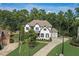 Beautiful two-story home with a modern design, well-manicured lawn, and a spacious driveway at 2295 Abbey Cove Ct, Marietta, GA 30062