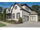 Lovely home featuring a painted brick facade, attached garage, and meticulously landscaped front yard at 2295 Abbey Cove Ct, Marietta, GA 30062