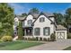 Stunning two-story home featuring a painted brick exterior, manicured lawn, and charming front porch at 2295 Abbey Cove Ct, Marietta, GA 30062