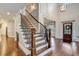 Grand foyer featuring hardwood floors, staircase with iron railings, and a view of the front door at 2295 Abbey Cove Ct, Marietta, GA 30062