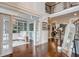 Elegant foyer with hardwood flooring, staircase, and French doors leading to the study at 2295 Abbey Cove Ct, Marietta, GA 30062